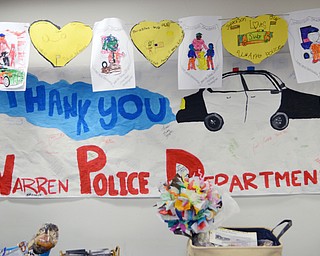 Katie Rickman | The Vindicator .Key Club and Student Council members from Warren G. Harding High School decorated a room in the basement of the Warren City Council Chambers on Thursday, Feb. 19, 2015 and donated lunch to the WPD. The decorations featured drawings and artwork from students from many grades.