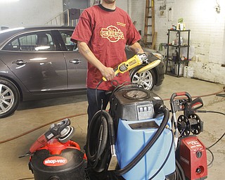        ROBERT K. YOSAY  | THE VINDICATOR..Anthony Young received a loan to purchase new equipment for his business, DNA Detailing on Mahoning Avenue.
