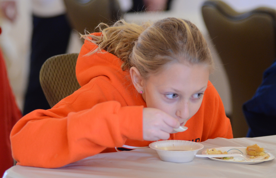 Katie Rickman | The Vindicator.The new Youngstown “Recipes of Youngstown” cook book is coming out later this year and will feature many family recipes for local dishes. Logan Lewis 11 of Niles eats wedding soup that will be featured in the new cook book.