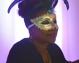 Katie Rickman | The Vindicator.Lisha Salter of Youngstown attends the Junior Civic League  4th AnnualMardi Gras Party at the Mahoning County Country Club in Liberty on Saturday, Feb. 21, 2015.