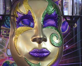 Katie Rickman | The Vindicator.Mardi Gras decor livens up the party during the Junior Civic League  4th AnnualMardi Gras Party at the Mahoning County Country Club in Liberty on Saturday, Feb. 21, 2015.