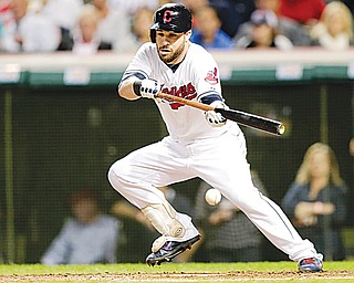 The Indians’ Jason Kipnis bunts against the Tampa Bay Rays during a game last season in Cleveland, After a string
of bad luck that included surgery and a case of debilitating food poisioning, Kipnis is ready for vindication in 2015.