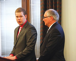 John Dellick, left, speaks during his sentencing hearing Thursday in Mahoning County Common Pleas Court as his attorney, Sam Amendolara, looks on.