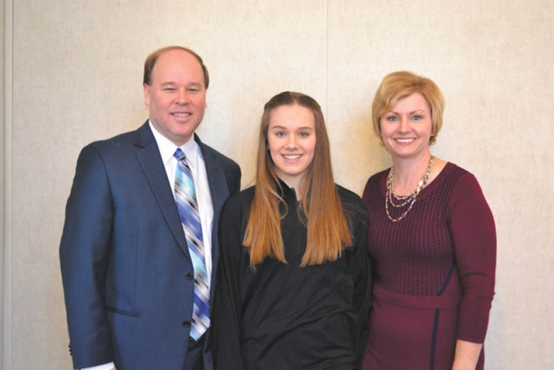 SPECIAL TO THE VINDICATOR: Dana Balash, with his daughter, Hannah, and wife, Kim, received the Distinguished Service Award from Holy Family School, Poland, during an all-school Mass said by the pastor, Monsignor William Connell, and Bishop George Murry. The Mass took place during Catholic Schools Week at the end of January. Principal Kathleen Stoops recognized Balash and his nine years of service. A reception took place for Balash and his family after the Mass. Also in attendance was Dr. Lois Cavucci, president of Lumen Christi Catholic Schools, of which Holy Family is a member.