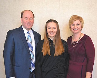 SPECIAL TO THE VINDICATOR: Dana Balash, with his daughter, Hannah, and wife, Kim, received the Distinguished Service Award from Holy Family School, Poland, during an all-school Mass said by the pastor, Monsignor William Connell, and Bishop George Murry. The Mass took place during Catholic Schools Week at the end of January. Principal Kathleen Stoops recognized Balash and his nine years of service. A reception took place for Balash and his family after the Mass. Also in attendance was Dr. Lois Cavucci, president of Lumen Christi Catholic Schools, of which Holy Family is a member.