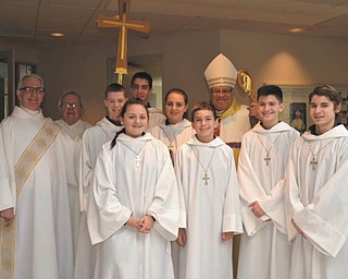 SPECIAL TO THE VINDICATOR: After the recent Mass for Catholic Schools week at Holy Family Church in Poland, clergy and altar server captains commemorated the event. From left to right are Deacon Ray Hatala; Monsignor William Connell; A.J. Pepperney, Mary Kate Zeno; Anthony Fire; Paige Brockway; Michael Appugliese; Bishop George Murry; Blake DelSignore and Nico Marchionda.