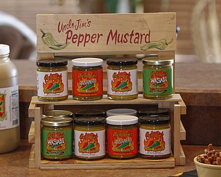        ROBERT K. YOSAY  | THE VINDICATOR..Uncle JimÕs Foods celebrated its fifth year in business by announcing new products, new locations and a new distributor relationship..The signature product, Uncle JimÕs Pepper Mustards, Jim and Karen Scher