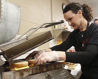        ROBERT K. YOSAY  | THE VINDICATOR..Barb Cummings....Canfield High School lunch time is  more the PBJ  - as  Panini's Salad home made soup ... etc  claims to be one of the best lunchrooms in the county ...