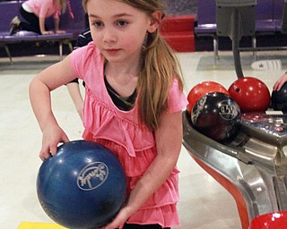 William D. Lewis The Vindicator  Peyton Summer, 6,of Austintown bowls in a after schhool youth bowling program at Camelot Lanes in Boardman