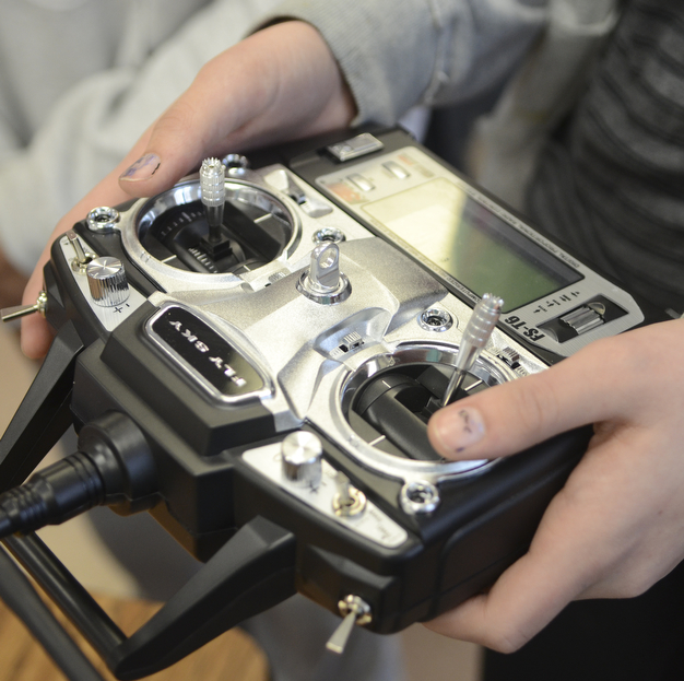 Katie Rickman | The Vindicator.A student holds the controller that controls the handmade drone that Canfield Middle School students have been working on in a STEM class.