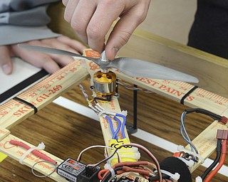 Katie Rickman | The Vindicator.A student turns the propellor of a drone made by STEM students at Canfield Middle School on Feb. 26, 2015.
