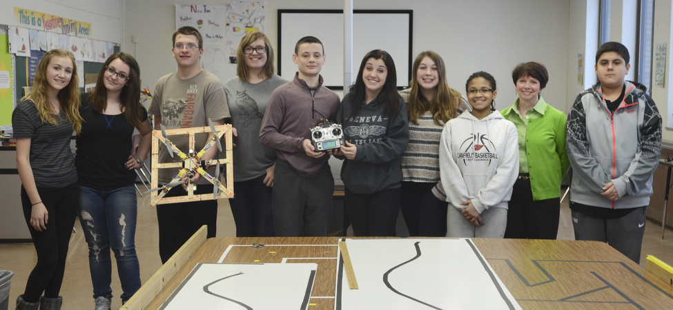 Katie Rickman | The Vindicator.Canfield Middle School STEM students hold up the handmade drone and pose for a photo with their teacher..L-R.Schalysse Theisler, Maddy Murphy, Dylan , Emma Bucheit , Fletcher Christi, Faith Slater, Sophia Campos, Destini Cospy, Laurie Howley (STEM teacher) and Gio Saadey.