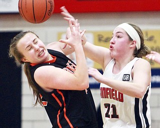 William D. Lewis the Vindicator Canfield's Rachel Tinkey(21) and Hoover's Alexis Green(22 go for a loose ball during 2-26-15 action in Canfield.