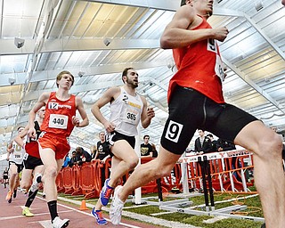 Jeff Lange | The Vindicator  Ryan Sullivan (440) freshman at YSU keeps up with the pack around the bend during the second heat of the men's 3000 meter run, Sunday afternoon YSU during the Horizon League Indoor Track Championship.