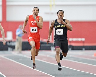 Jeff Lange | The Vindicator  Youngstown's Marcellus Embry (444) runs to the finish line of the 200 meter dash with Milwaukee's Alex Hatlevig (372), Oakland's Aaron Davis (291) and UIC's Martin Hunter (262), Sunday afternoon during the Horizon League indoor track Championship in Youngstown.