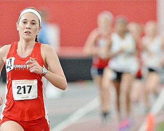 Jeff Lange | The Vindicator  YSU's Brittany Stockmast speeds ahead of a pack of runners during heat one of the 3,000 meter run at Sunday's Horizon League indoor track Championship in Youngstown.