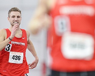 Jeff Lange | The Vindicator  Youngstown's Eric Rupe (436) grits his teeth as he sprints the final 100 meters of the 3,000 meter run, Sunday during the Horizon League Championship in Youngstown.