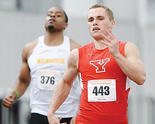 YSU’s Carl Zallow sprints to the finish ahead of Milwaukee’s Davontae Johnson to win the men’s 200-meter dash at Sunday’s Horizon League track and field championship in the WATTS at YSU. Zallow, a Warren JFK standout, also won the 60 and anchored YSU’s fifth place 4x400 relay to earn track freshman of the year.