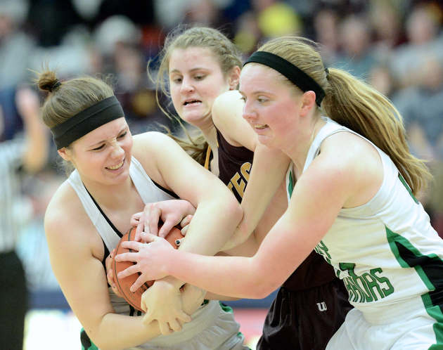 Jeff Lange | The Vindicator  West Branch's Paige Walsh (left) and Lea Bock (right) fight for possession of the ball with Southeast's Danielle Norquest in the second quarter of their sectioinal semi-final matchup in Austintown, Monday evening.