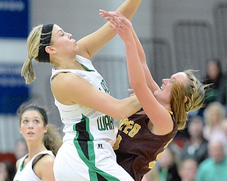 Jeff Lange | The Vindicator  West Branch's Pavin Heath (left) smacks down a pass thrown by Southeast's Madison Dunn during early third quarter action of their sectional semi final game at Austintown Fitch High School, Monday night. The Lady Warriors beat the Pirates 64 to 52.