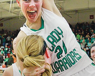West Branch senior Pavin Heath and her teammates celebrate after defeating Mogadore Field for their second consecutive Division II district title on Thursday at Fitch High School in Austintown. The Warriors downed the Falcons, 55-29, behind Melinda Trimmer, who finished the night with 24 points.