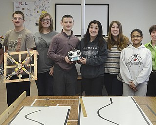 Katie Rickman | The Vindicator.Canfield Middle School STEM students hold up the handmade drone and pose for a photo with their teacher..L-R.Schalysse Theisler, Maddy Murphy, Dylan , Emma Bucheit , Fletcher Christi, Faith Slater, Sophia Campos, Destini Cospy, Laurie Howley (STEM teacher) and Gio Saadey.