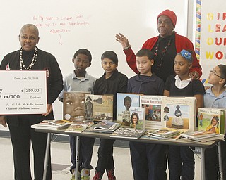        ROBERT K. YOSAY  | THE VINDICATOR..Students  l-r  Gabriel Ferguson - Anabel Castro - Nathaniel Torres- Kaelyn Spell - Lemuel Bonilla - ..Adults  are Misha Scott - Princiapal  Dr  Michelle McCollin - Marcia  Haire- Ellis - and  Nikki Davis.. 50 books were donated to Discovery at Volney school Thursday by the Youngstown Alumnae Chapter of Delta Sigma Theta Sorority, Inc. The sorority also donated a $250 check which Principal Misha Scott said will be used to by more books for the school.