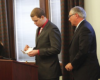        ROBERT K. YOSAY  | THE VINDICATOR..John Dellick reads from a prepared statement ...  John Dellick received 18 months of probation today and also must perform 160 hours of community service..Dellick was sentenced after pleading guilty Dec. 8 to aggravated assault and a misdemeanor assault charge. with him is Lawyer Samuel Amendolara.