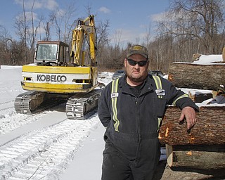        ROBERT K. YOSAY  | THE VINDICATOR..Bill Spithaler kept telling the 911 dispatch that it needed to send in a helicopter to help him..“This is a helicopter ride out of here. There is nothing a fire department has that can get me out of here,” the 48-year-old recalled. He was deep in the woods at a logging site near Raccoon Road and Four Mile Run and he was having a serious asthma attack while working in 10 inches of snow.