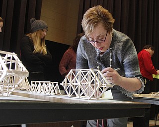        ROBERT K. YOSAY  | THE VINDICATOR....Thirty-five teams from 18 area high schools did thier best at building the best foot-long balsa-wood bridge at the 8th annual Miniature Bridge Building Competition Friday, Feb. 27, in Kilcawley Center at Youngstown State University..