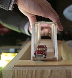        ROBERT K. YOSAY  | THE VINDICATOR..The bridges must not only hold weight but also must allow a car to go across the bridge ..Thirty-five teams from 18 area high schools did thier best at building the best foot-long balsa-wood bridge at the 8th annual Miniature Bridge Building Competition Friday, Feb. 27, in Kilcawley Center at Youngstown State University..