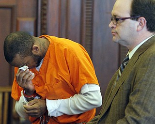        ROBERT K. YOSAY  | THE VINDICATOR..Larry Johnson, 40, of Shelby Road, sentenced to 15 years to life in prison today in Mahoning County Common Pleas Court for the New Years Eve 2013 beating and stabbing death of his 26-year-old girlfriend, LaShea Parker, inside their home - Lou DeFabio was his attorney