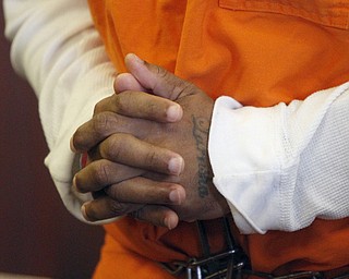        ROBERT K. YOSAY  | THE VINDICATOR..Larry Johnson, 40, of Shelby Road, sentenced to 15 years to life in prison today in Mahoning County Common Pleas Court for the New Years Eve 2013 beating and stabbing death of his 26-year-old girlfriend, LaShea Parker, inside their home - Lou DeFabio was his attorney