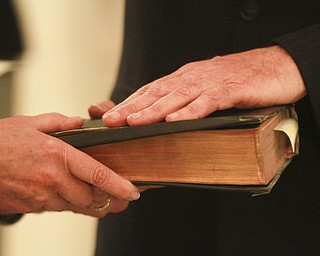 William D. Lewis The Vindicator Ralph Meachum is sworn in as Mahoning County Auditor in the rotunda of the Mahoning County Courthouse  3-3-15. 7th district court of appeals judge Carol Ann Raub, administered the oath.