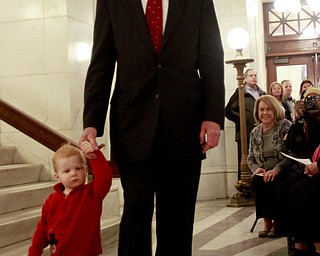 William D. Lewis The Vindicator Ralph Meachum and his grandson connor Quinn, 20 months, walk into the Mahoning County Courthouse rotunda for Meachum's swearing in as county auditor 3-3-15.
