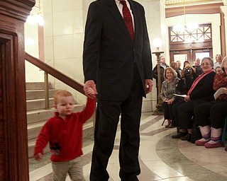 William D. Lewis The Vindicator Ralph Meachum and his grandson connor Quinn, 20 months, walk into the Mahoning County Courthouse rotunda for Meachum's swearing in as county auditor 3-3-15.
