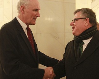 William D. Lewis The Vindicator Ralph Meachum , left,gets congrats from magistrate Tim Welh afer beingsworn in as Mahoning County Auditor in the rotunda of the Mahoning County Courthouse  3-3-15.