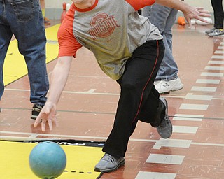 Katie Rickman | The Vindicator.Eric Quattro of Boardman bowls during relay type game with his son Vincent during Gym Night with Dad at Stadium Drive Elementary School. Approximately 84 attended the night of fun which included the entire fourth grade class.