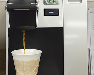 Katie Rickman | The Vindicator.A Keurig brews a cup of coffee at Marlowe's Premium Coffee Service on March 4, 2015. Marlowe's has begun distributing Keurig to YSU.