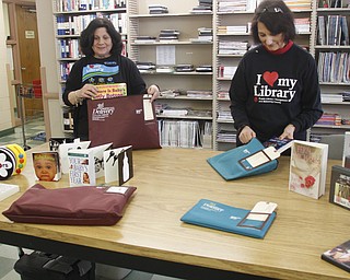        ROBERT K. YOSAY  | THE VINDICATOR.. Marian Carrabbia  Loretta Angelo andbooks  etc to be mailed out to shut-ins - a service the library is expanding to new mothers and to all senior citizens over 65, who find it difficult to get to a library, especially in inclement weather.  ..
