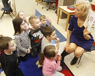        ROBERT K. YOSAY  | THE VINDICATOR..Poland Union Elementary pre school program .. will be expanded and moved to Poland North - Next school year .Joy Bucci reads Wacky Wednesday to the students in the pre school at Poland Union Elementary
