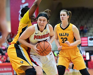 YOUNGSTOWN, OHIO - MARCH 7, 2015: Heidi Schlegel #15 of YSU spins to the basket inside of Sharon Karungi #33 of Valpo during the 1st half of Saturday afternoons NCAA basketball game at Beeghly Center. (Photo by David Dermer/Youngstown Vindicator) Dani Franklin #32 of Valpo pictured.