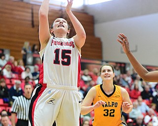YOUNGSTOWN, OHIO - MARCH 7, 2015: Heidi Schlegel #15 of YSU puts up a shot after getting past Dani Franklin #32 of Valpo during the 1st half of Saturday afternoons NCAA basketball game at Beeghly Center. (Photo by David Dermer/Youngstown Vindicator)