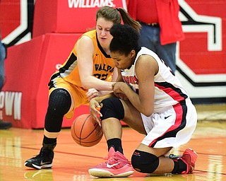 YOUNGSTOWN, OHIO - MARCH 7, 2015: Tisha Walker #32 of YSU and Dani Franklin #32 of Valpo battle for a loose ball under the basket during the 1st half of Saturday afternoons NCAA basketball game at Beeghly Center. (Photo by David Dermer/Youngstown Vindicator)