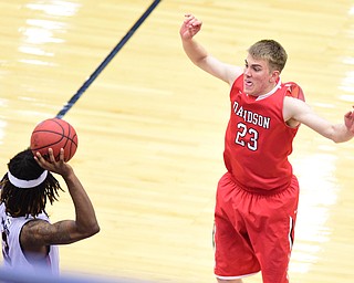 PITTSBURGH, PENNSYLVANIA - MARCH 7, 2015:  Peyton Aldridge #23 of Davidson attempts to prevent Dominique McKoy #3 of Duquesne during the 2nd half of Saturday nights game against Duquesne at the Palumbo Center. (Photo by David Dermer/Youngstown Vindicator)