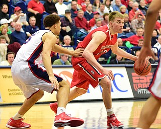 PITTSBURGH, PENNSYLVANIA - MARCH 7, 2015:  Peyton Aldridge #23 of Davidson dribbles the ball while being guarded by TySean Powell #5 of Duquesne during the 2nd half of Saturday nights game against Duquesne at the Palumbo Center. (Photo by David Dermer/Youngstown Vindicator)