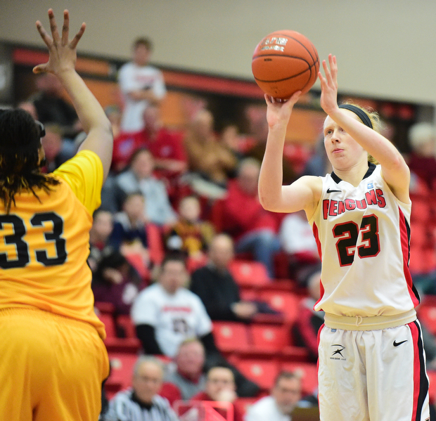 YOUNGSTOWN, OHIO - MARCH 7, 2015: Sarah Cash #23 of YSU shoots a 3 point shot over Sharon Karungi #33 of Valpo during the 1st half of Saturday afternoons NCAA basketball game at Beeghly Center. (Photo by David Dermer/Youngstown Vindicator)