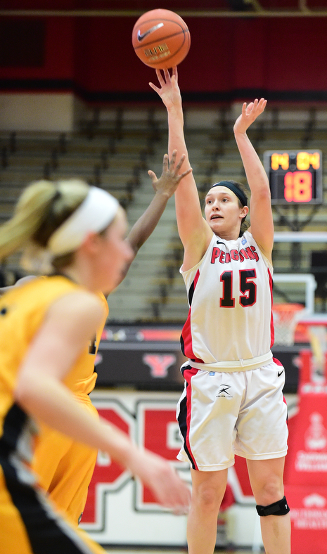 YOUNGSTOWN, OHIO - MARCH 7, 2015: Heidi Schlegel #15 of YSU shoots a 3 point over during the 1st half of Saturday afternoons NCAA basketball game at Beeghly Center. (Photo by David Dermer/Youngstown Vindicator)