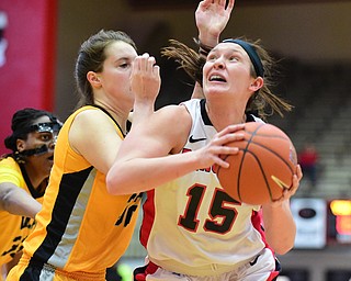 YOUNGSTOWN, OHIO - MARCH 7, 2015: Heidi Schlegel #15 of YSU looks to the basket after spinning away from Dani Franklin #32 of Valpo during the 1st half of Saturday afternoons NCAA basketball game at Beeghly Center. (Photo by David Dermer/Youngstown Vindicator)