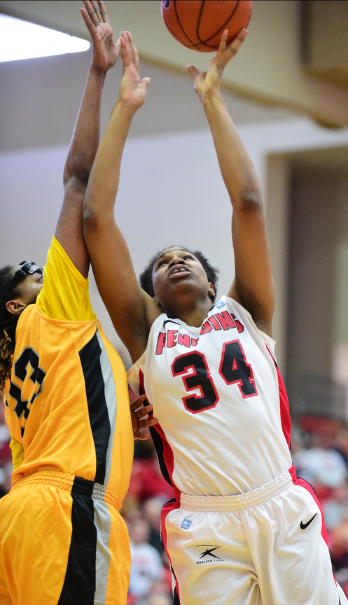 YOUNGSTOWN, OHIO - MARCH 7, 2015: Tisha Walker #32 of YSU puts up a shot over Sharon Karungi #33 of Valpo during the 1st half of Saturday afternoons NCAA basketball game at Beeghly Center. (Photo by David Dermer/Youngstown Vindicator)